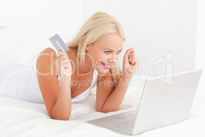 Cheerful woman purchasing online