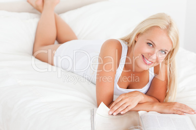 Smiling woman with a magazine