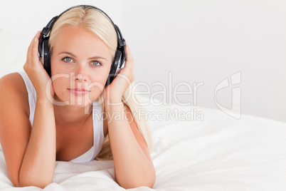 Blonde woman listening to music