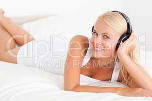 Delighted woman listening to music