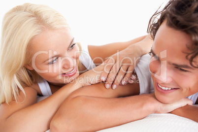 Laughing couple lying down