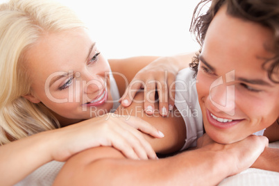 Laughing couple lying