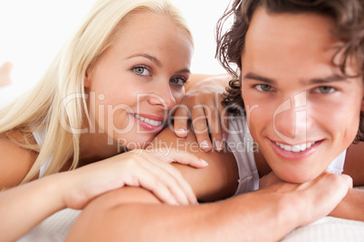 Smiling couple lying