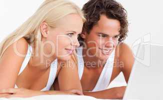 Young couple using a laptop