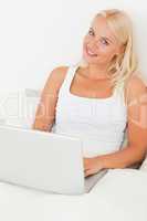 Portrait of a cute woman using a laptop