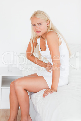 Portrait of a sick woman having a stomachache