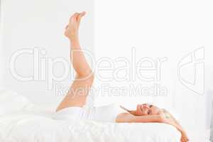 Smiling woman with the legs up