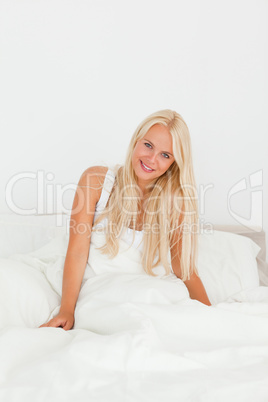 Portrait of a blonde woman waking up