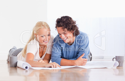 Smiling couple getting ready to move in a new house