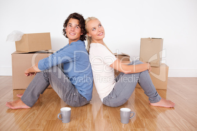 Lovely couple sitting on the floor