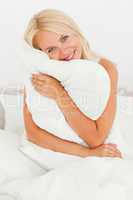 Woman holding a pillow