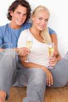Portrait of a couple with glasses of sparkling wine