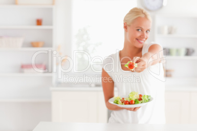 Woman giving a tomato