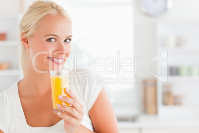 Close up of a woman drinking juice