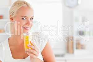 Close up of a woman drinking juice