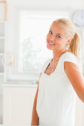 Woman standing in her kitchen