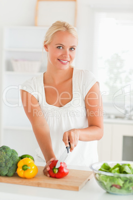 Woman slicing pepper