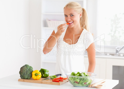 Woman eating pepper