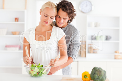 Couple preparing a salad