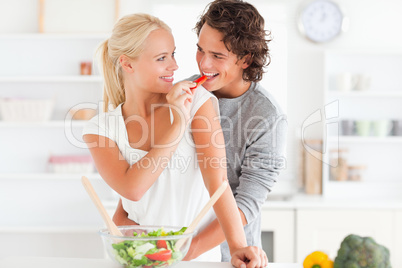 Woman giving pepper to her fiance