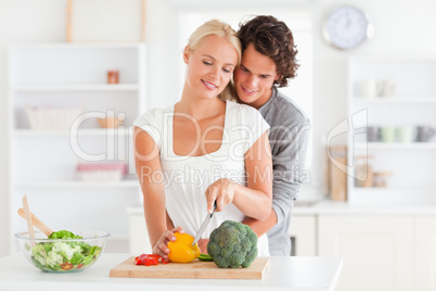 Couple slicing pepper Couple slicing pepper