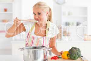 Blonde woman tasting her meal