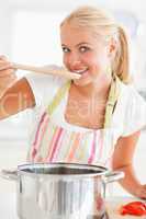 Portrait of a woman tasting her meal