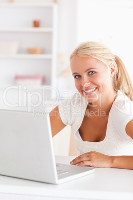 Portrait of a cute woman with a laptop