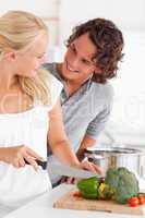 Portrait of a couple cooking