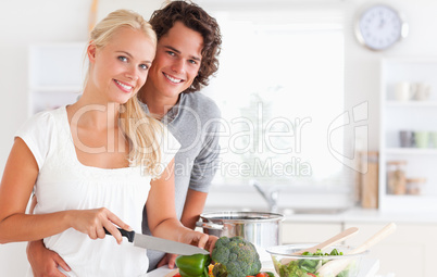 Beautiful couple cooking