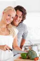 Portrait of a beautiful couple cooking