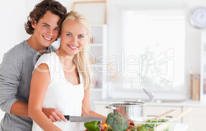 In love young couple cooking
