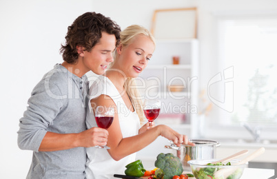 Young couple having a glass of red wine