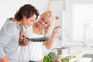 Couple cooking with a pan