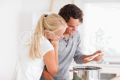 Couple tasting a meal