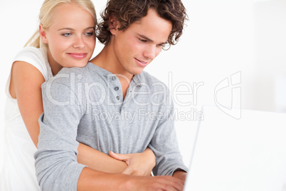 Close up of a couple using a notebook