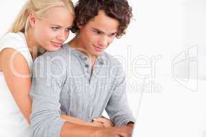 Close up of a couple using a laptop