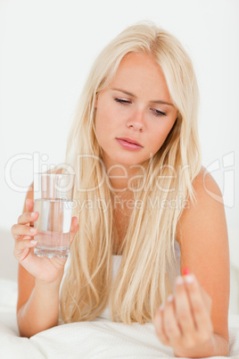 Portrait of a woman taking her medication