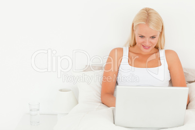 Beautiful blonde woman using a laptop