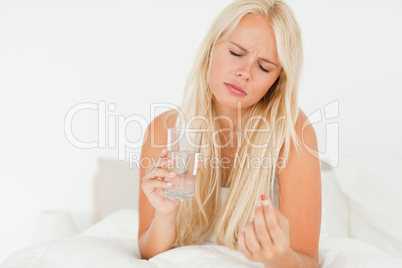 Woman taking a pill