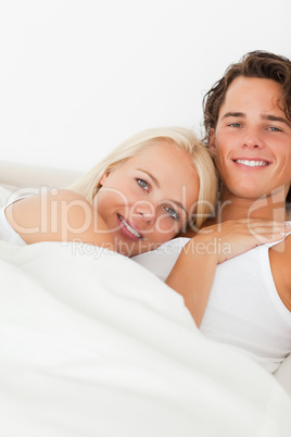 Portrait of a couple in their bed