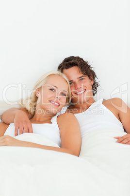 Portrait of a couple posing in their bedroom