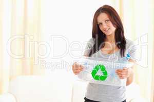 Woman holding recycling bin