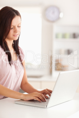 Woman typing on laptop