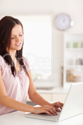 Woman typing on her laptop