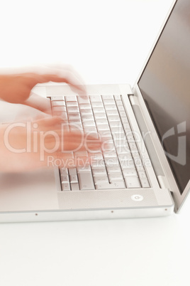 Blurred hands on keyboard