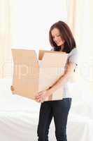 Woman looking into cardboard