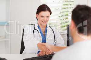 Female doctor greeting a patient