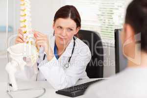 Female doctor showing doctor something