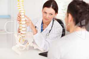 Female doctor showing doctor spine